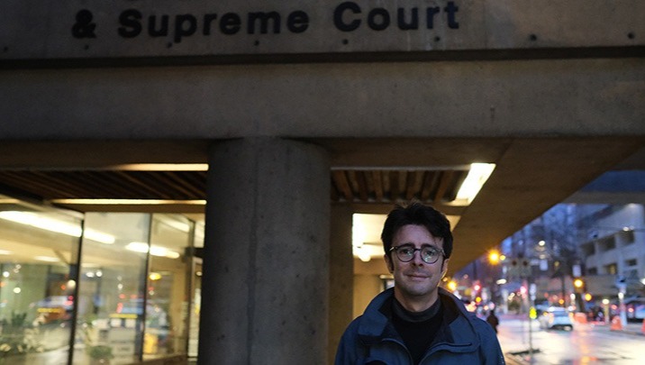 Ian Linkletter stands in front of BC Court of Appeal & Supreme Court in Vancouver, BC, Canada.